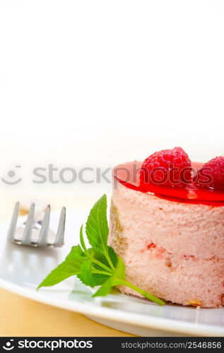 fresh raspberry cake mousse dessert round shape with mint leaves