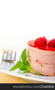 fresh raspberry cake mousse dessert round shape with mint leaves