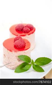 fresh raspberry cake mousse dessert round shape with mint leaves