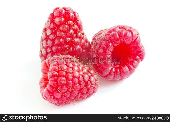 fresh raspberry fruits isolated on white background