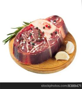 fresh raw beef steak with bone and rosemary on cutting board isolated on white background.. raw beef steak isolated on white background