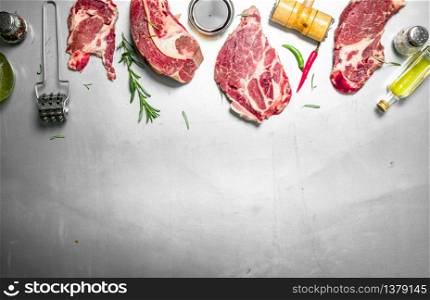 Fresh raw beef steak with spices. On rustic background.. Fresh raw beef steak with spices.