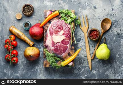 Fresh raw beef steaks on wooden cutting board.Raw ribeye beef steak with seasonings. Raw marbled beef steaks
