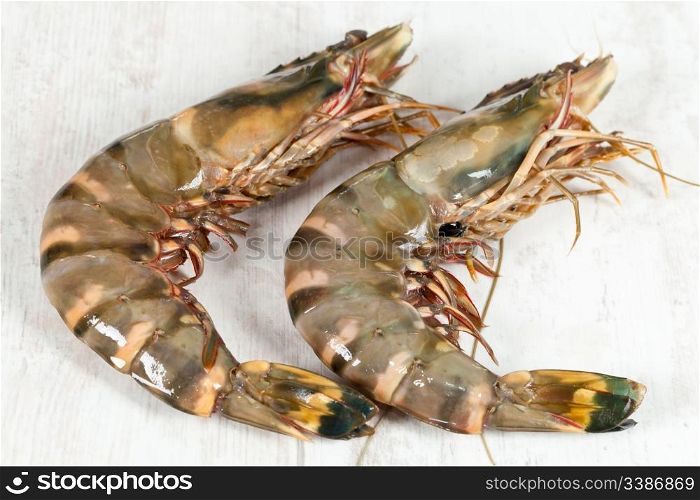 Fresh raw big prawn on wooden background