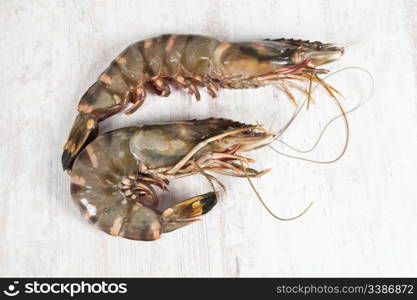 Fresh raw big prawn on wooden background