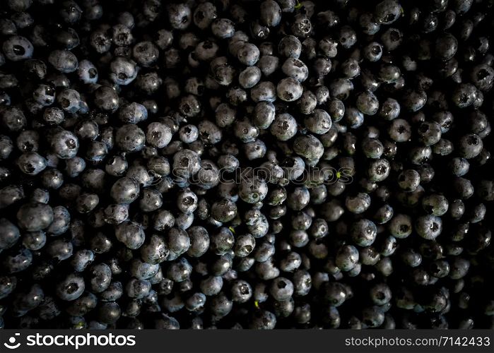 Fresh raw blueberries as background, top view