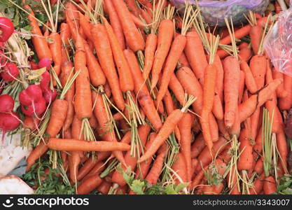 Fresh raw carrots vegetables at the market