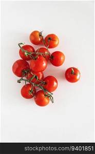 Fresh raw cherry tomatoes on white table. Top view