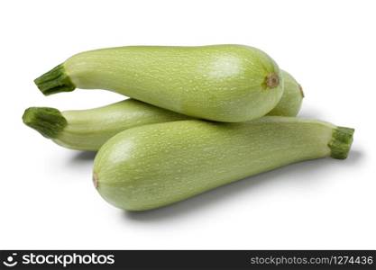 Fresh raw green courgettes on white background