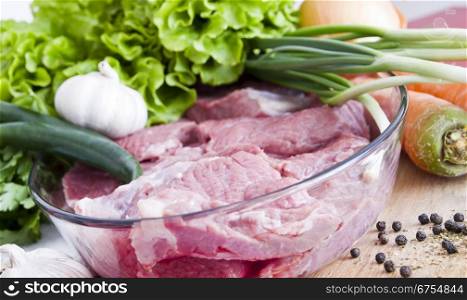 Fresh raw meat with vegetables