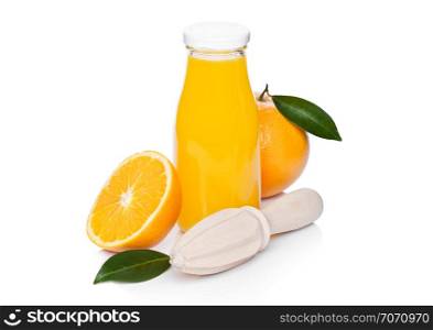 Fresh raw peeled oranges with hand wooden juice squeezer and glass bottle with leaves on white background