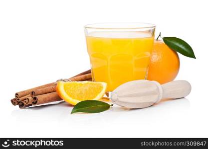 Fresh raw peeled oranges with hand wooden juice squeezer with leaves and raw cinnamon on white background