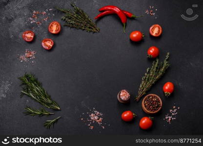 Fresh raw pork meat on the ribs with spices and herbs on a wooden cutting board on a dark concrete background