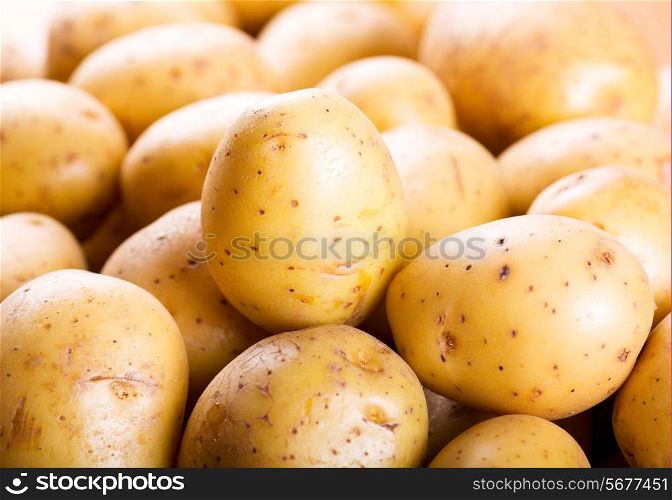 fresh raw potatoes as background