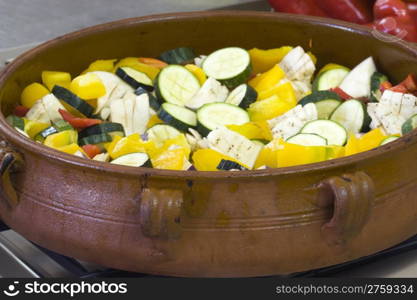 Fresh raw ratatuille in an earthenware container