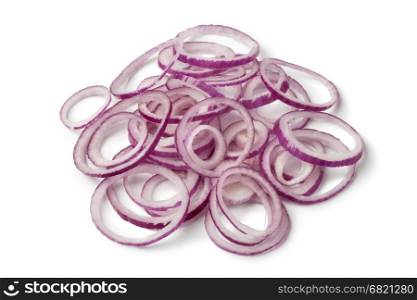 Fresh raw red onion rings on white background