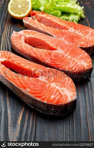 Fresh Raw Salmon Red Fish Steak on wooden background. Fresh Raw Salmon Red Fish Steak