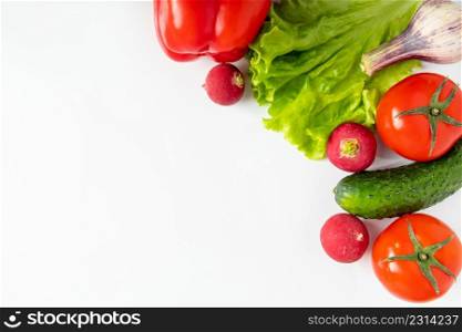 Fresh raw vegetables on a white background. Vegan eco food. Place for text.. Fresh vegetables on a white background. Vegan eco food. Place for text.