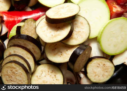 fresh raw vegetables red paprika, eggplant, vegetable marrow, tomato for healthy lunch