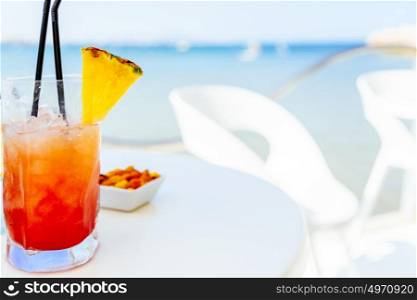 Fresh Red And Orange Cocktail Glass In Summer With Ocean Background