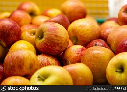 Fresh red and yellow apples at market