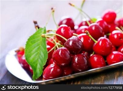 fresh red cherry onthe wooden table