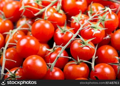 fresh red cherry tomatoes as background