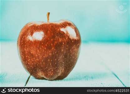 Fresh Red Delicious Apple On Turquoise Wood Table