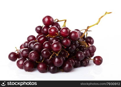 Fresh red grapes and water drops isolated on white background