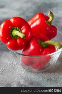 Fresh red peppers in the glass bowl