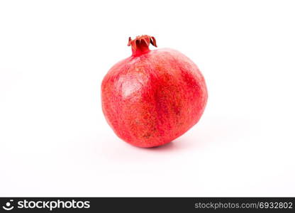 fresh red pomegranate isolated on white background