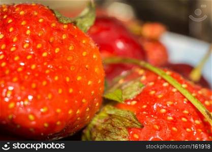 Fresh red ripe strawberry, close up photo.