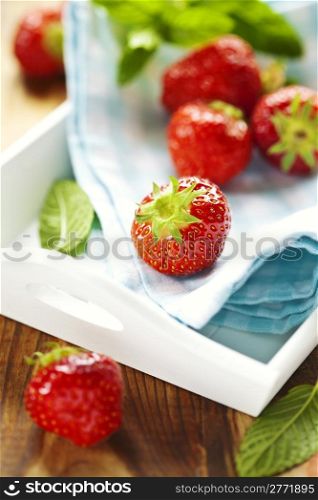 fresh red strawberries on wooden table