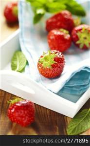fresh red strawberries on wooden table