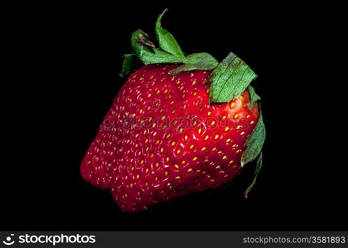 fresh red strawberry isolated on a black background