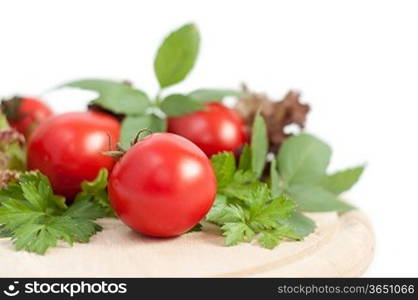 fresh red tomatoes,basil and pepper on white background