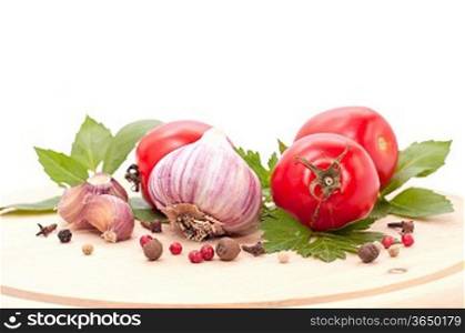 fresh red tomatoes,basil,parsley and pepper on white background
