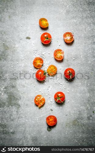 Fresh red tomatoes. On a stone background. . Fresh red tomatoes. On stone background.