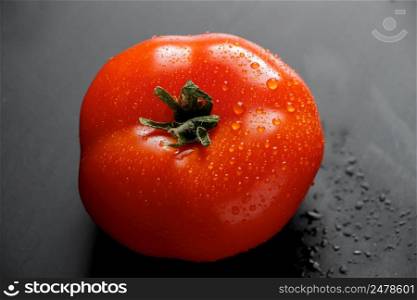 Fresh red tomatoes with drops of water. Farm vegetables for vegan diet.. Fresh tomatoes with drops of water. Farm vegetables for vegan diet.