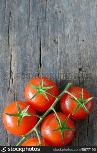 fresh, ripe cherry tomatoes on wood