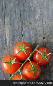 fresh, ripe cherry tomatoes on wood