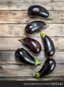Fresh ripe eggplant. On wooden background. Fresh ripe eggplant.