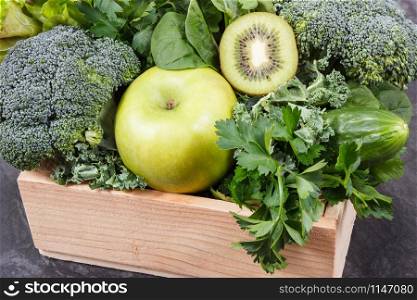 Fresh ripe green fruits with vegetables as healthy food containing natural vitamins or minerals. Body detox concept. Fresh ripe green fruits with vegetables as healthy food containing vitamins or minerals. Body detox