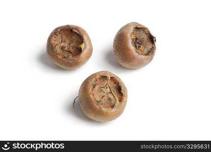 Fresh ripe Medlars on white background