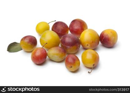 Fresh ripe mirabelle plums on white background