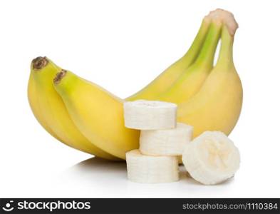 Fresh ripe organic bananas cluster with sliced pieces on white.