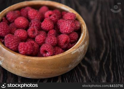 Fresh ripe raspberry. Fresh ripe raspberry on a wooden plate