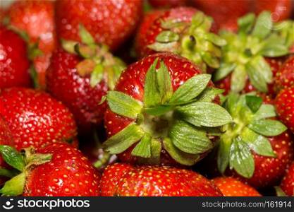 Fresh ripe strawberries background, close up photo.