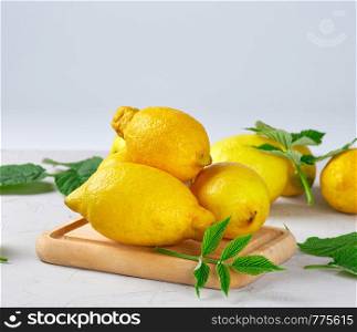 fresh ripe whole yellow lemons, ingredients for making summer drinks, close up