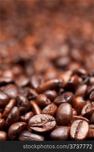 fresh roasted coffee beans background with focus foreground